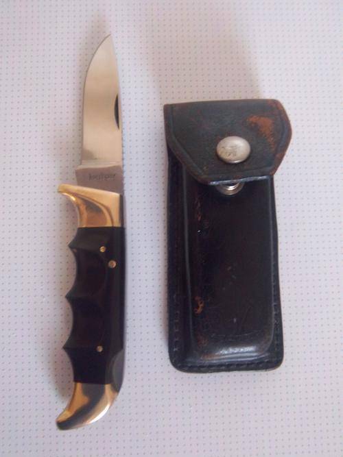 Knives Kershaw 1050 knife with original leather sheath was sold for