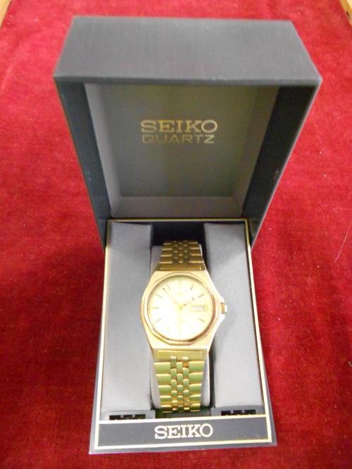 Seiko best sale sq100 gold