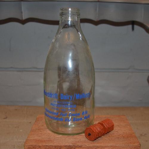 Advertising ORIGINAL DAIRY BELLE TOKENS and milk bottle was sold for