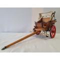 A vintage detailed miniature Ox-drawn 2 seater wagon/cart with a canopy