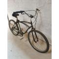A vintage Raleigh Retroglider bicycle with Shimano brakes