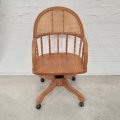 A stunning Oak bentwood mobile office chair with wicker seat and back and adjustable height and r...