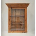 A gorgeous antique solid Oregon bathroom cabinet with leaded windows and two shelves