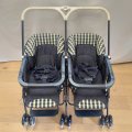 A very well made Italian Peg-Perego "Caravel" blue and white twin pram/ stroller with brakes and ...