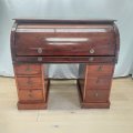 An incredible antique Victorian Mahogany roll-top pedestal desk with pull-out writing top and amp...