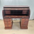 An incredible antique Victorian Mahogany roll-top pedestal desk with pull-out writing top and amp...