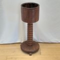 An incredible antique Partridge wood barrel-top planter stand with a turned centre column and stu...