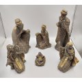 A beautiful large 7 piece gold Nativity set including the 3 wise men, Mary and Joseph and baby Jesus