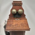 A rare antique (c1905) LM Ericsson wall mounted crank telephone with a Bakelite handset and duel ...
