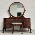 A stunning original "Jonkers of Knysna" solid Stinkwood 7-drawer ball and claw dressing table wit...