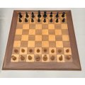 A beautifully made solid Teak wood chess board (50cm x 50cm) with a complete vintage chess set