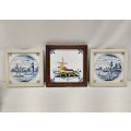 Three wonderful vintage framed Dutch themed porcelain wall tiles including two blue and white tiles