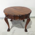 A stunning round vintage solid stinkwood drum-top ball and claw coffee table