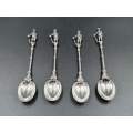 A set of four stamped 835 silver Boer soldier finial spoons