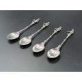 A set of four stamped 835 silver Boer soldier finial spoons