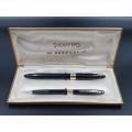 A vintage Sheaffer white dot Snorkel pen and pencil set in original case