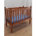 An awesome vintage solid wood drop-side baby`s cot/ crib/ bassinet with a mattress on its origina...