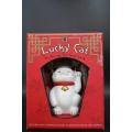 A "Maneki Neko" Chinese/Japanese Lucky Cat waving beckoning wealth