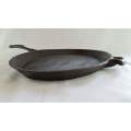 Large oval cast iron griddle pan - used. Perfect for steak!