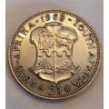 A South African Unity is Strength 1910-1960 5 shilling coin in good condition.