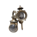 An authentic nautical brass lantern and electric wall light