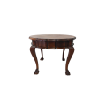 A stunning round vintage solid stinkwood drum-top ball and claw coffee table