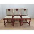 A set of six vintage carved Teak upholstered dining chairs