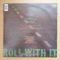 Steve Winwood  Roll With It -  Vinyl LP Record - Very-Good+ Quality (VG+)