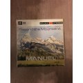 Manuel - Beyond The Mountains - Vinyl LP Record  - Opened  - Very-Good+ Quality (VG+)