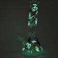 Glass beaker bong with glow-in-the-dark decal prints