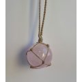 Dreamy netted rose quartz crystal sphere necklace