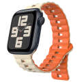 For Apple Watch SE 2023 44mm Reverse Buckle Two Color Magnetic Silicone Watch Band(Starlight+Orange)