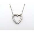 18K gold diamond heart necklace by Browns.