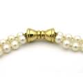 Double strand of pearls with gold plated magnetic clasp.