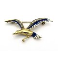 18K gold diamond and enamel "Bird in flight" brooch.