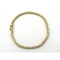 18kt gold diamond tennis bracelet.