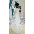April, crepe mermaid with lace detailed bodice wedding dress.