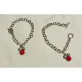 Silver bracelet with clasp / red bead and diamante detail