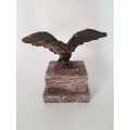 Brass eagle on ceramic base