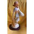 Vintage sculpture/figurine of young girl holding a fish basket