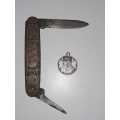 Paul Kruger trench coin and pocket knife