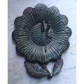 Vintage bronze sundial with dragonfly