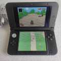 Nintendo 3ds XL console with original charger, stylus and memory card