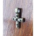 Metal cross pendant with decorative stones