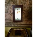 Table lamp with decorative glass panel