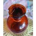 Vintage amber glass bottle with glass stopper