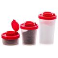A Set Of Salt and Pepper Shakers with Red Covers Lids Jar Dispenser