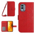 For Nokia X30 HT04 Skin Feel Sun Flower Embossed Flip Leather Phone Case with Lanyard(Red)