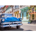 Vintage classic american car in a colorful street of Havana