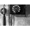 Vintage black phone hanging on wall